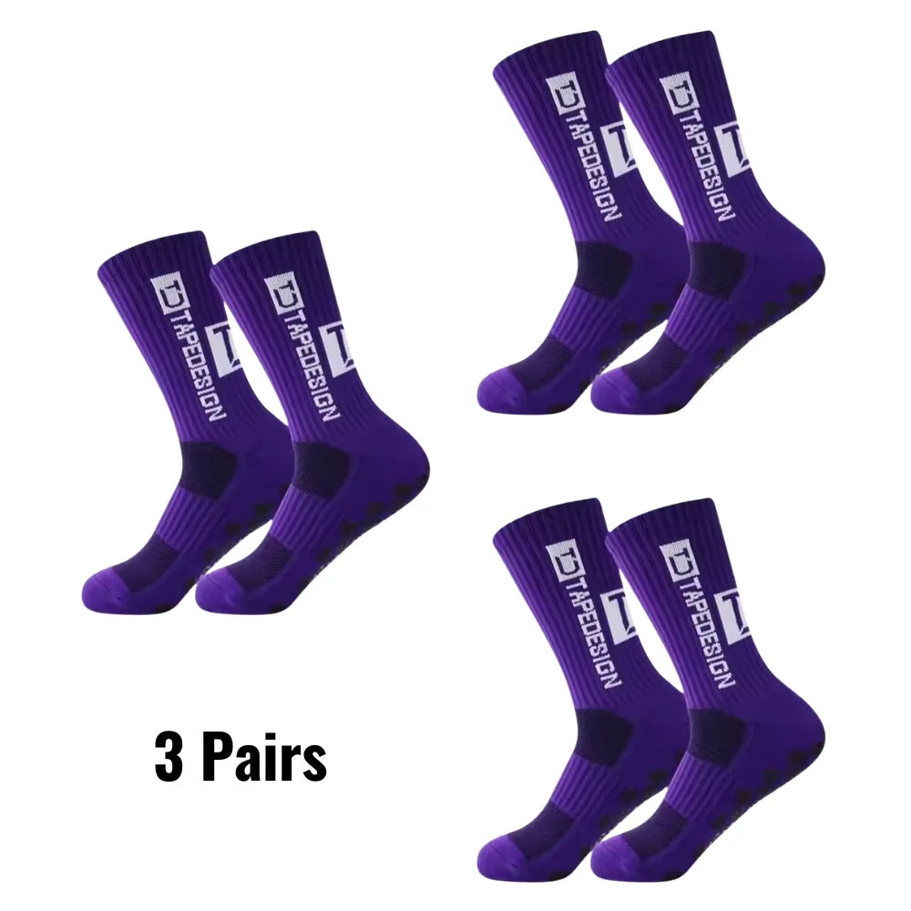Set of 3 pairs of purple Tapedesign non-slip socks with '3 pairs' text.