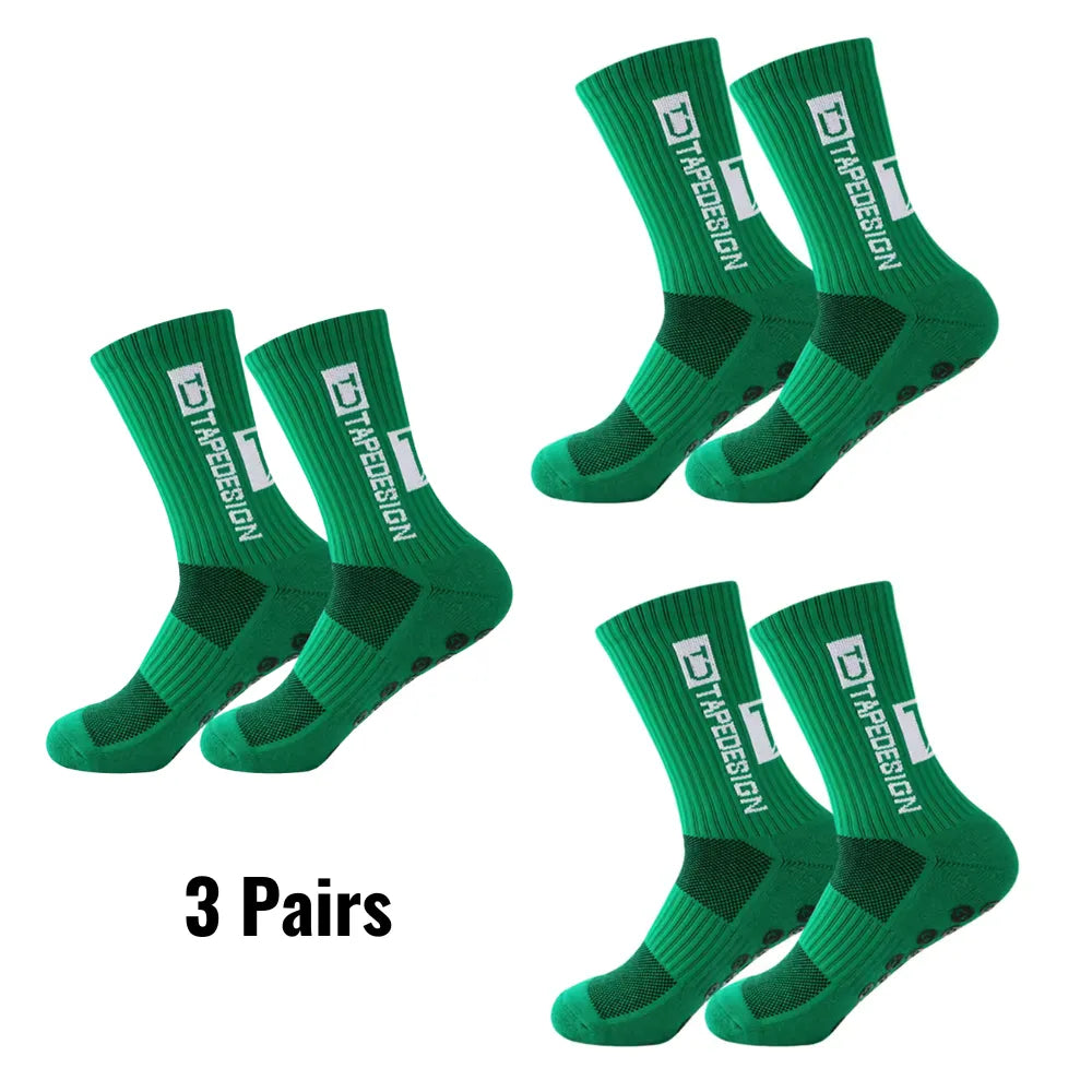 Set of 3 pairs of green Tapedesign non-slip socks with '3 pairs' text.