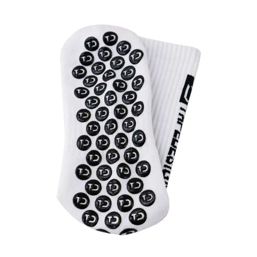 Close-up of Tapedesign non-slip socks sole, highlighting the grip dots and durable polyester material.